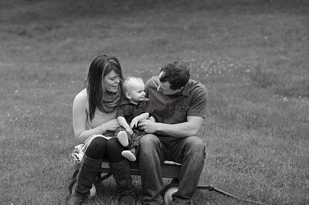 istock Family Sitting on Vintage Wagon 471827119