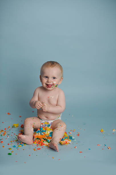 istock Messy Baby Eating Birthday Cake 471827167