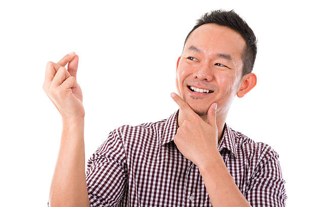 istock Asian man hand holding blank sign 471827247
