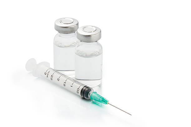 istock Medical ampules and syringe isolated 471827864