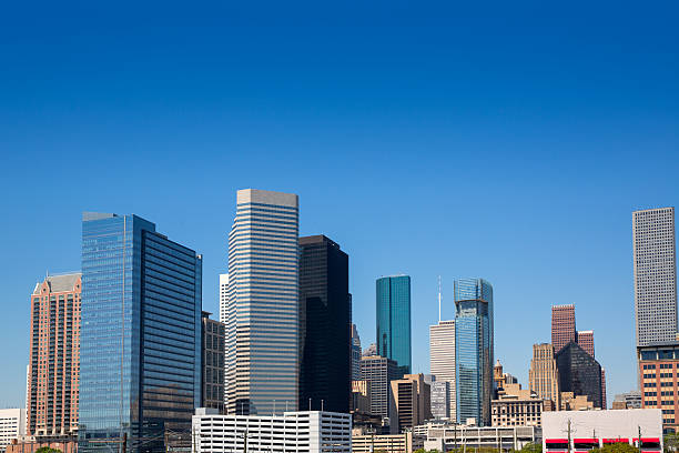 istock Houston downtown skyscrappers skyline on blue sky 471828303