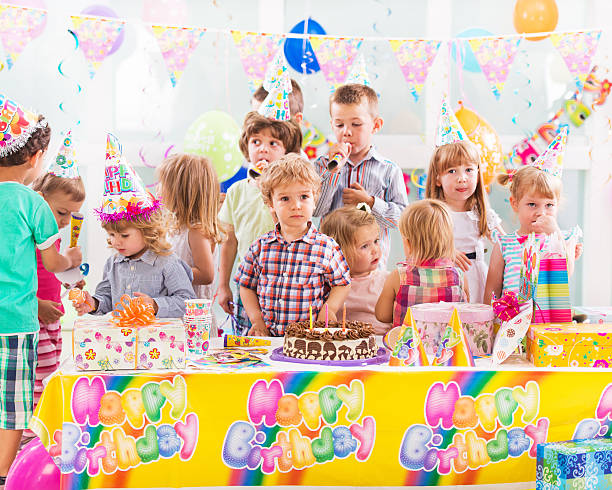 istock Large group of children celebrating birthday. 471829082