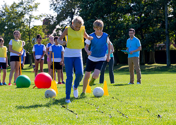 Obstacle Course Competition Young teens taking part in an obstacle course on a school sports day. obstacle course stock pictures, royalty-free photos & images