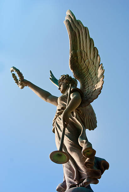 Archangel Gabriel holding her horn and a vicory wreath.  Detail of a statue on the grounds of the State Capitol of Arkansas.  The statue was sculpted by Frederic Wellington Ruckstull and dedicated on June 4, 1905 to honor those Confederate soldiers who died in the Civil War.
