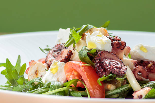 istock Octopus salad with rucola, olives and feta cheese 471831870