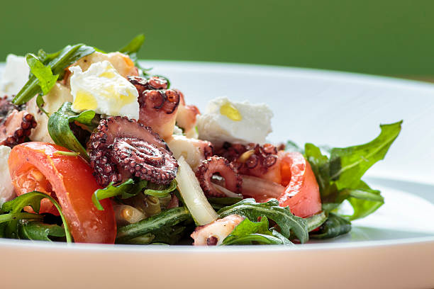 istock Octopus salad with rucola, olives and feta cheese 471831960
