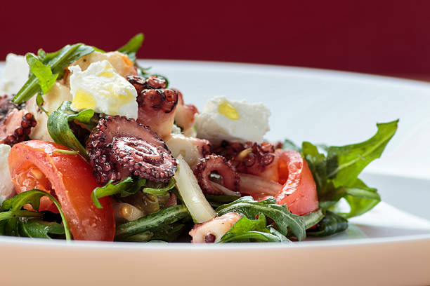istock Octopus salad with rucola, olives and feta cheese 471832274