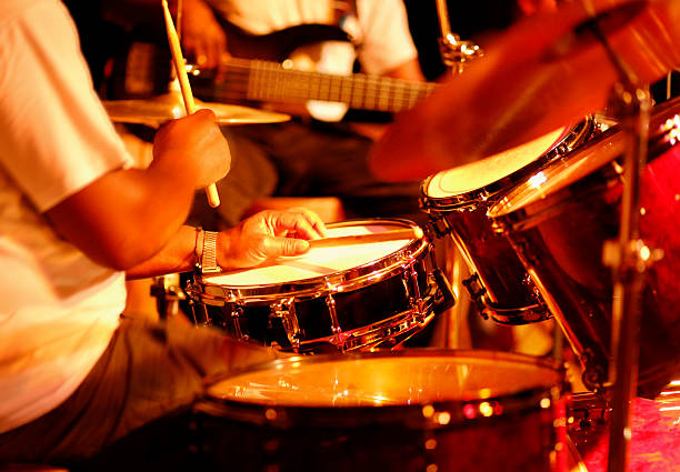Drummer playing on stage Drummer playing on stage bass drum photos stock pictures, royalty-free photos & images