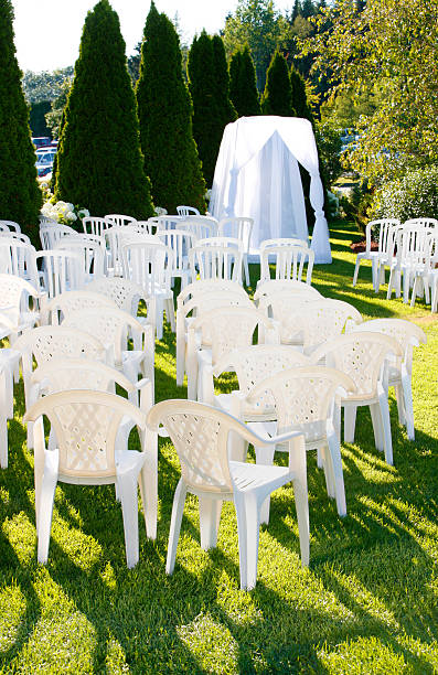 istock Outdoor wedding setup with chairs and veils. 471835119