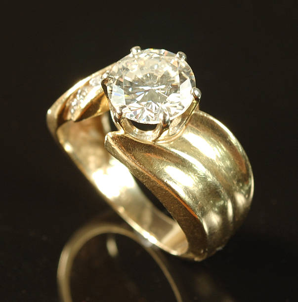 istock Woman's Diamond and Yellow Gold Wedding Ring 471836941
