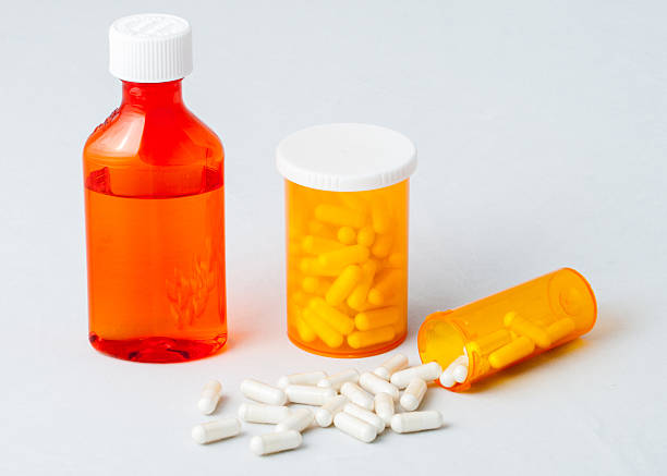 istock Pharmacy Vials and Oval Bottle with Capsules 471837303