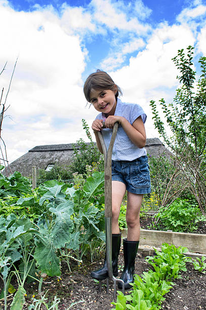 istock Young girl gardening 471837717
