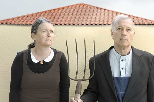 Farming couple, in parody of the famous 1930 painting 'American Gothic Couple'