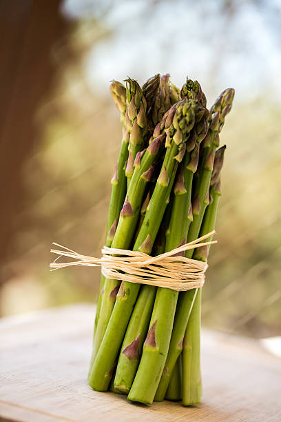 istock Fresh green asparagus bunch isolated on white 471838360