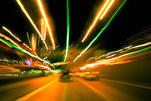 istock Highway driving at night with long exposure light trails 471839561