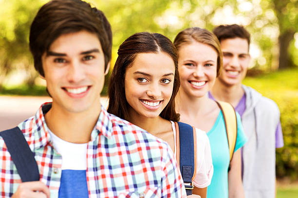 istock Group of College Students Standing In A Row On Campus 471840239