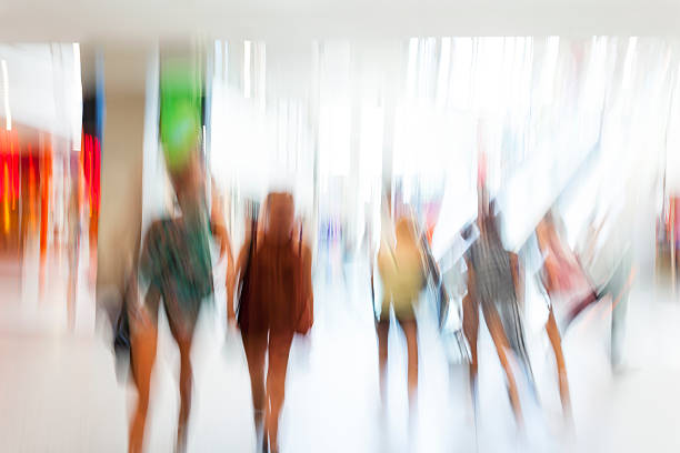 istock Blurred People Walking Fast in Shopping Mall 471840427