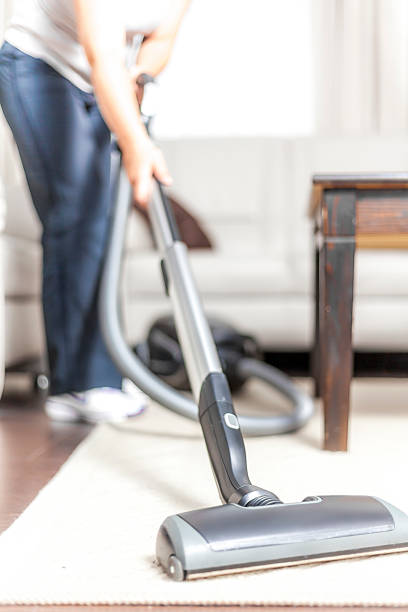 istock Woman Vacuuming 471841139