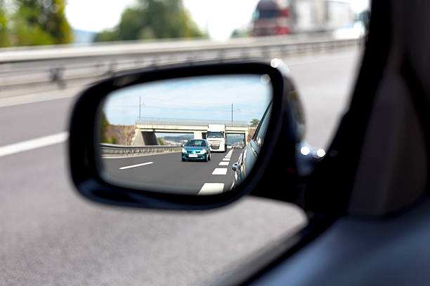 Highway side view mirror reflection VI stock photo