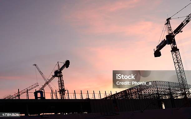 Cranes In The Construction Of Large Buildings Stock Photo - Download Image Now - 2015, Adult, Backgrounds