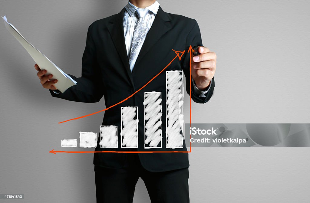 Business man hand drawing  graph Business man hand drawing a graph Achievement Stock Photo