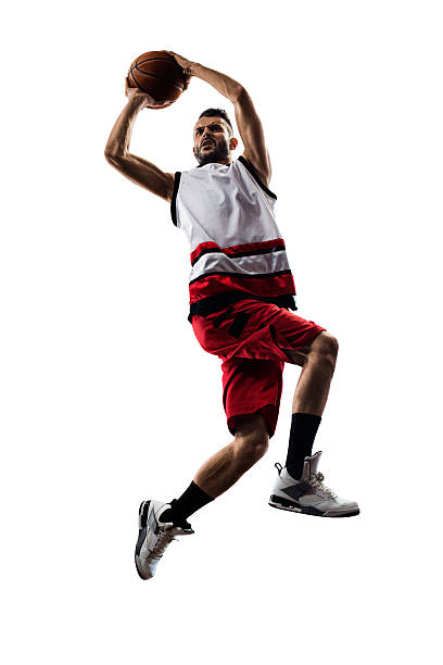istock Isolated basketball player in action is flying high 471842364