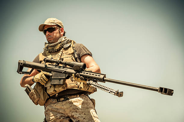 Modern Army Sniper Standing Tall with Barrett M82A1 Precision Rifle stock photo
