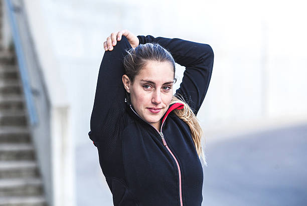 istock Exercising young woman outdoors 471843334