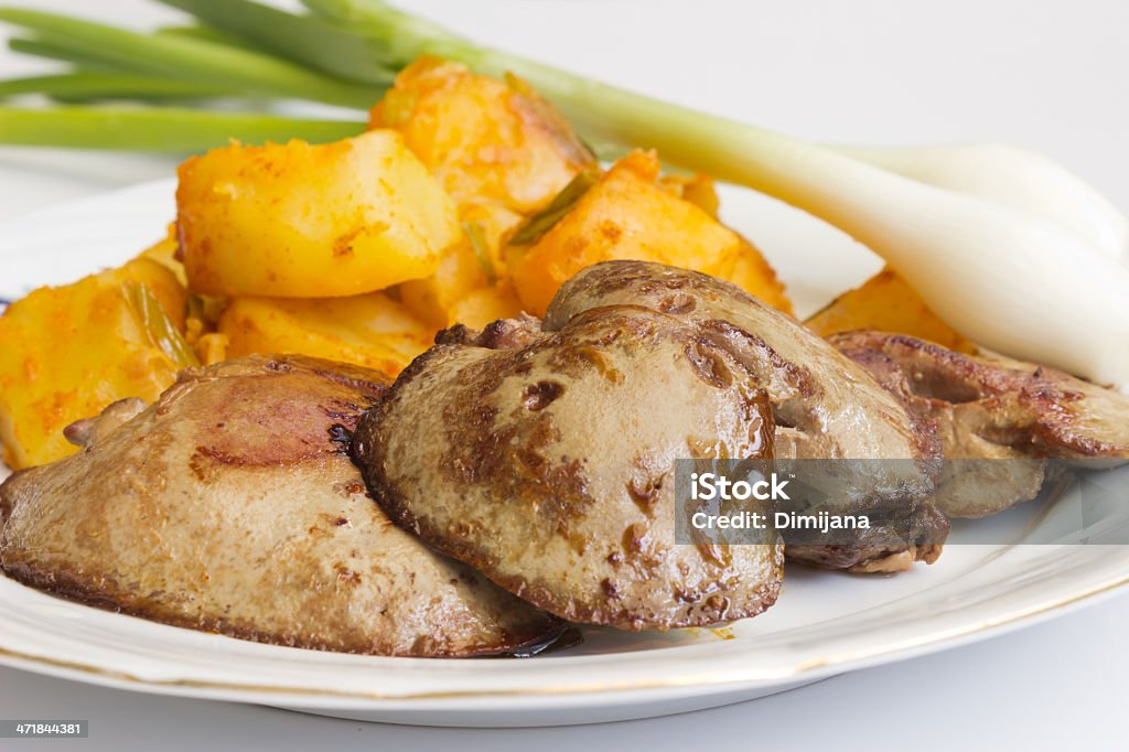 Fried liver Fried liver served with potatoes and onions Animal Digestive System Stock Photo