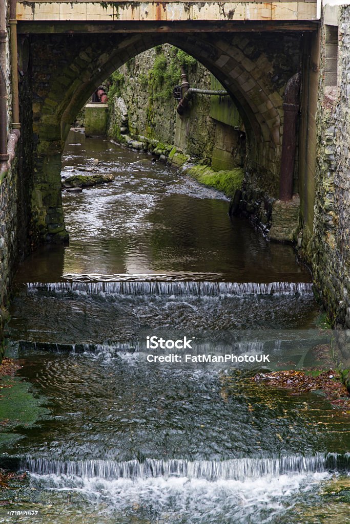 Lyme Regis Stream The River Lym flows through Lyme Regis, here the Lym is flowing through the seaside town of Lyme Regis, Dorset, England, United Kingdom. Arch - Architectural Feature Stock Photo Lyme Regis Stream The River Lym flows through Lyme Regis, here the Lym is flowing through the seaside town of Lyme Regis, Dorset, England, United Kingdom. Arch - Architectural Feature Stock Photo