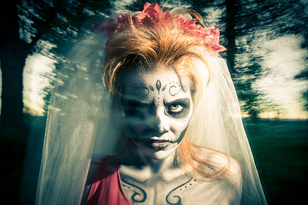 Day of the dead bride in elaborate costume and makeup Day of the dead bride in elaborate costume and makeup. Property released and creation created by Rayce Bird. scary bride stock pictures, royalty-free photos & images