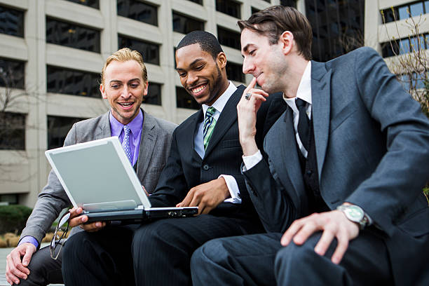 istock Three Businessmen and a Laptop 471847339