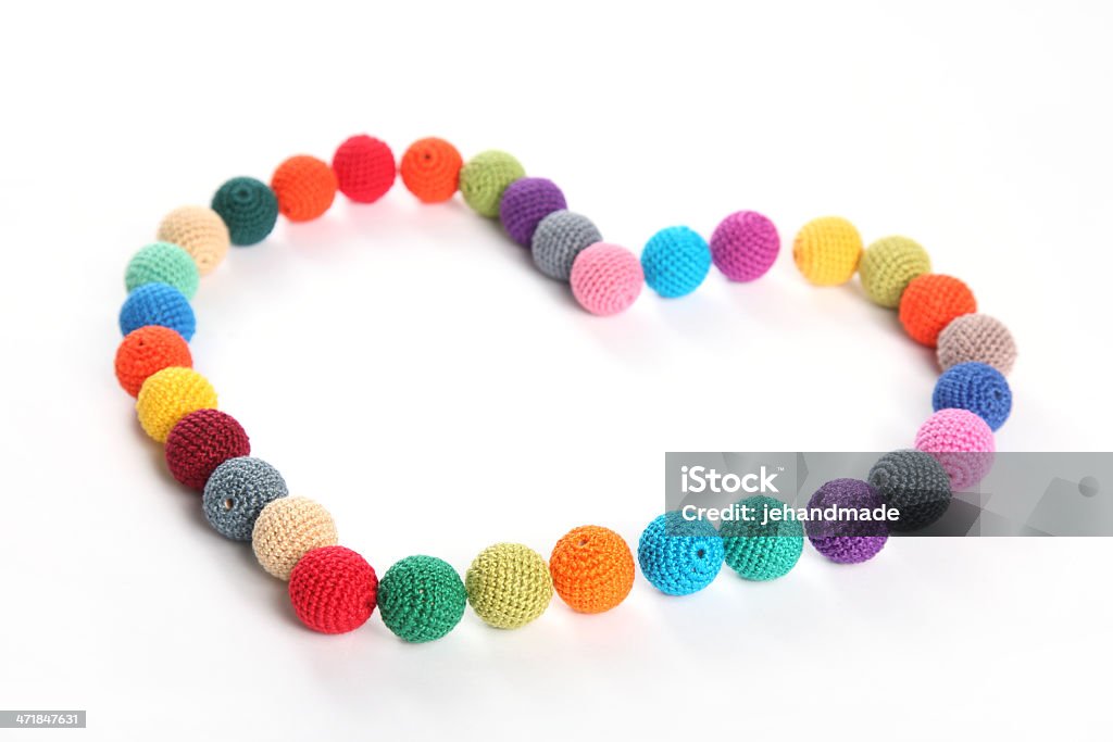 Crochet beads balls in form of heart Art And Craft Stock Photo