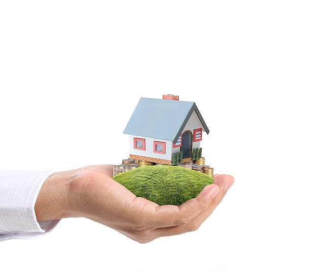 istock holding house representing home ownership 471849975