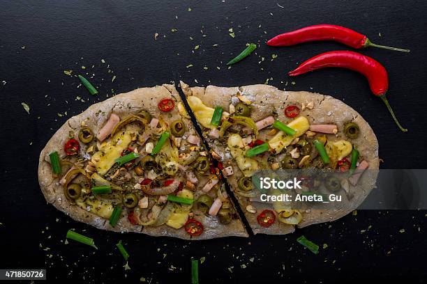 Focaccia With Olives Peppers And Chicken On A Black Board Stock Photo - Download Image Now