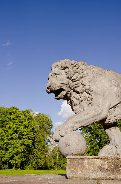 istock vintage lion sculpture in the old park 471850931