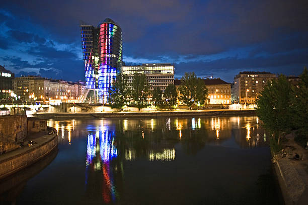 istock glass front of office tower by night 471851061