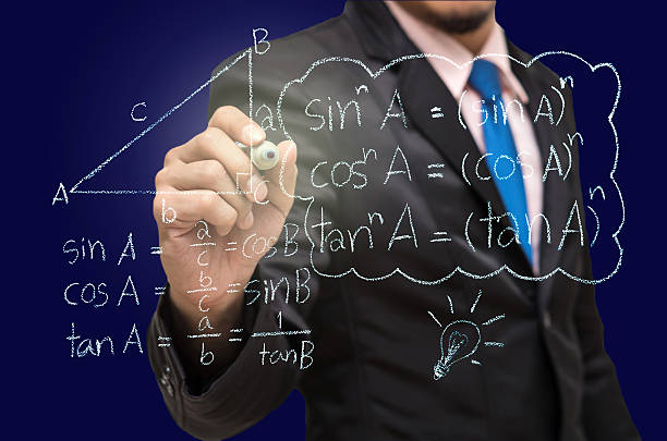 istock Businessman writing the mathematics formulas on a blackboard 471851622