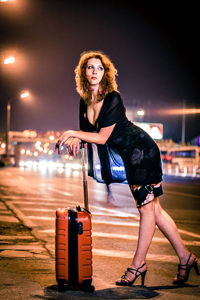 Woman with a suitcase in the city