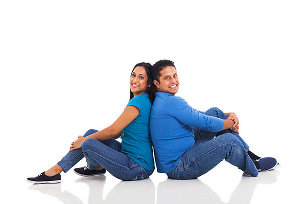 istock young indian couple sitting on the floor 471851709