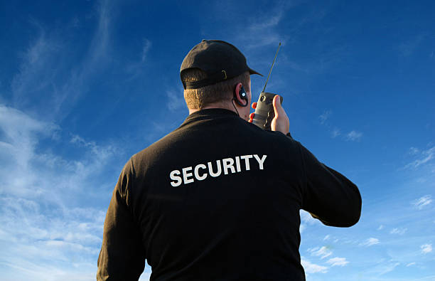 back of a security guard back of a security guard isolated on white security guard photos stock pictures, royalty-free photos & images