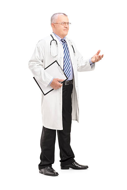 istock Male medical doctor in a uniform explaining 471856027