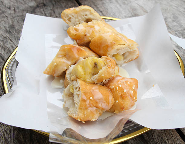 istock Deep-fried dough stick banana inside with milk Breakfast in thai 471856649