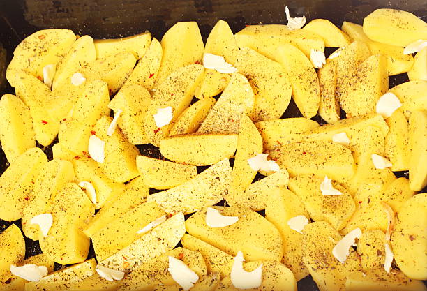 istock Raw potatoes with spices ready to be roasted 471857419