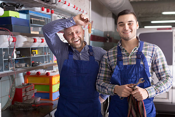 istock Workmen in auto repair shop 471859358