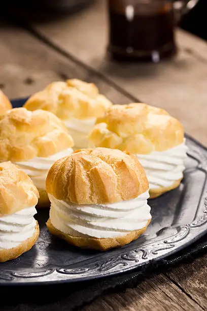 A profiterole or creampuff (in French choux à la crème) is a choux pastry puff ball filled with whipped cream or pastry cream.