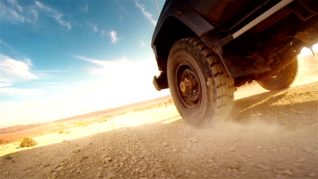 Off road in desert in Africa. Tread on the tire close-up.