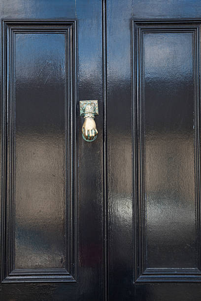 istock Black Door With Brass Styled Hand Knocker 471862465