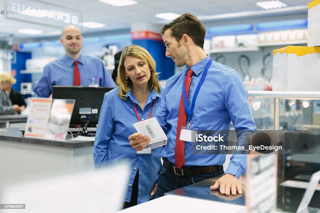 Retail store manager and his team Retail store manager talking with his sales team. Horizontal shot. Education Training Class Stock Photo