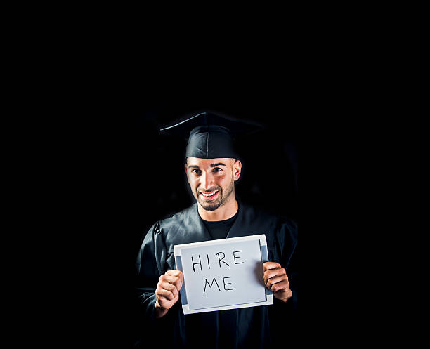 istock Happy New Graduate With Hire Me Sign 471864091
